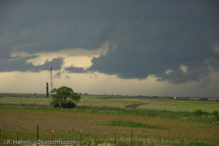 Looking west at numerous lowerings and scud clouds